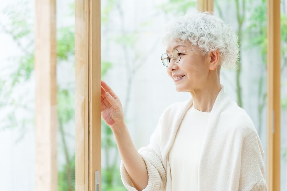 elderly-women-sitting-with-eyes-closed-1 asian middle aged woman stadning at window (1)