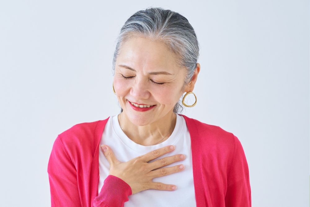 elderly black woman drinking herbal tea 