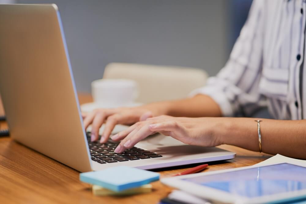 lady typing on laptop 